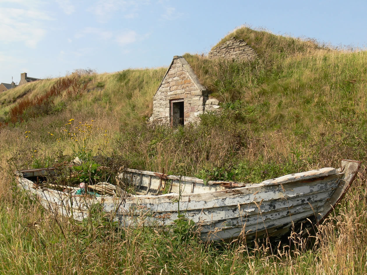 Caithness | Keiss Harbour - Ice House and old wooden fishing boat