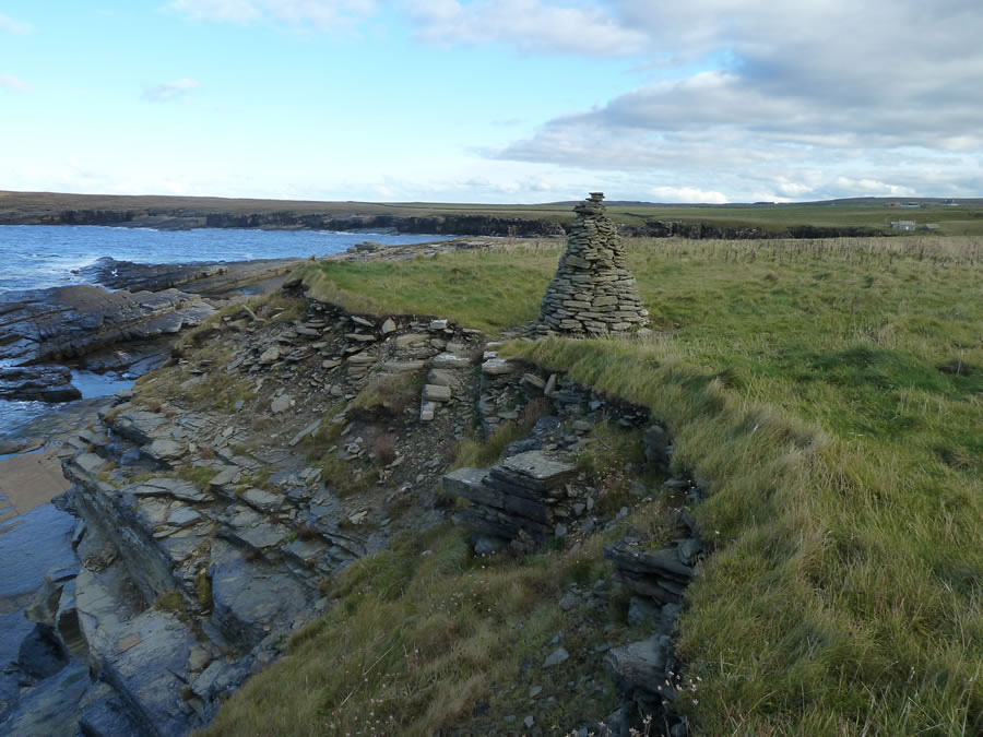 Crosskirk Cairn located near the location of the broch