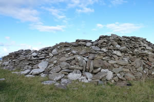 Building ruin and mound of stones - Caithness, Scotland