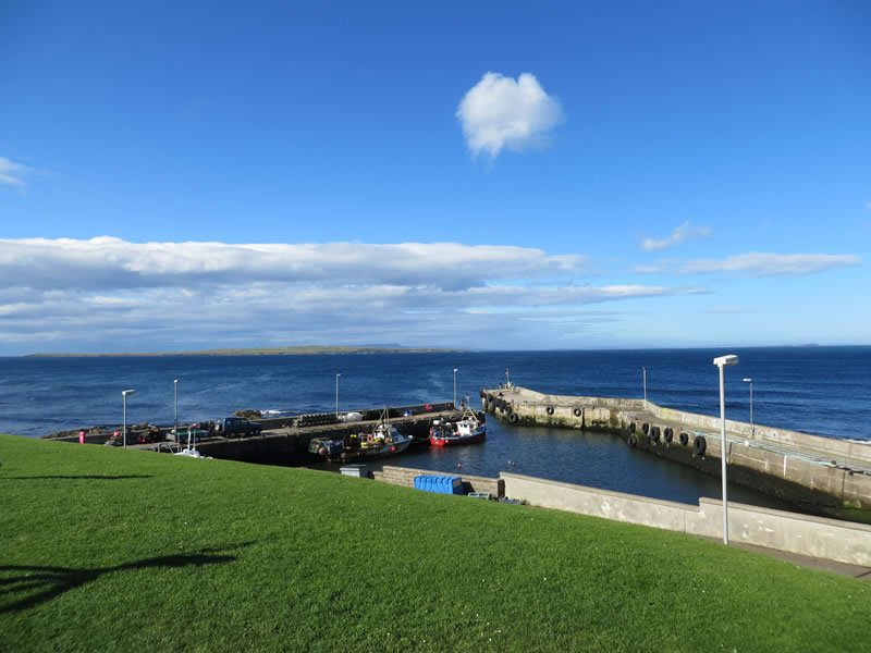 Harbour with the Island of Stroma in the distance
