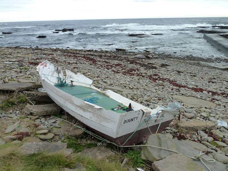 Wrecked boat on shoreline
