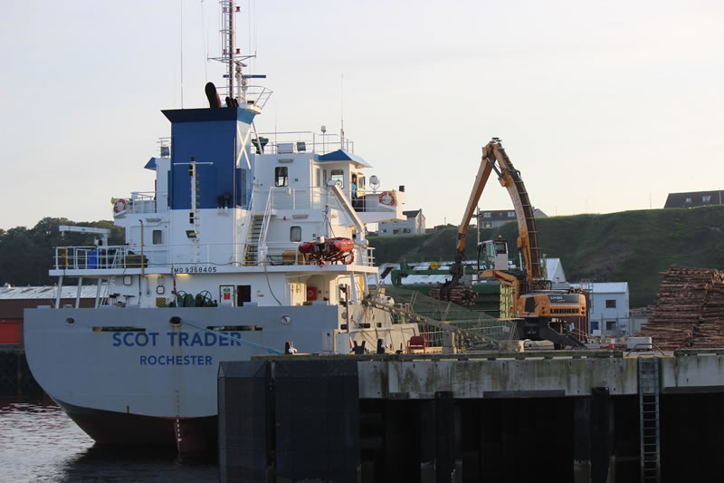 Ship being loaded with timber at Scrabster harbour