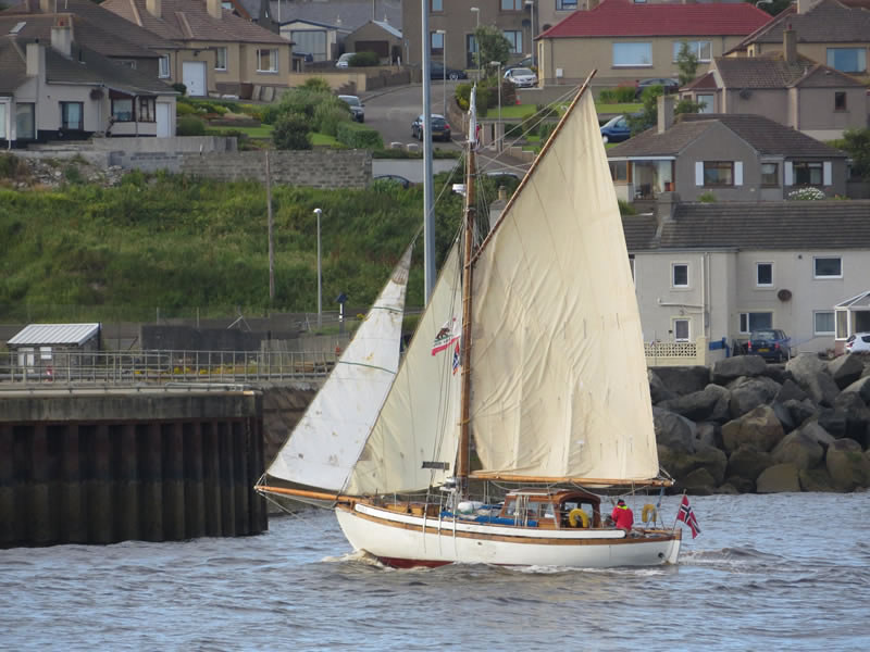 Yacht sailing into Wick harbour